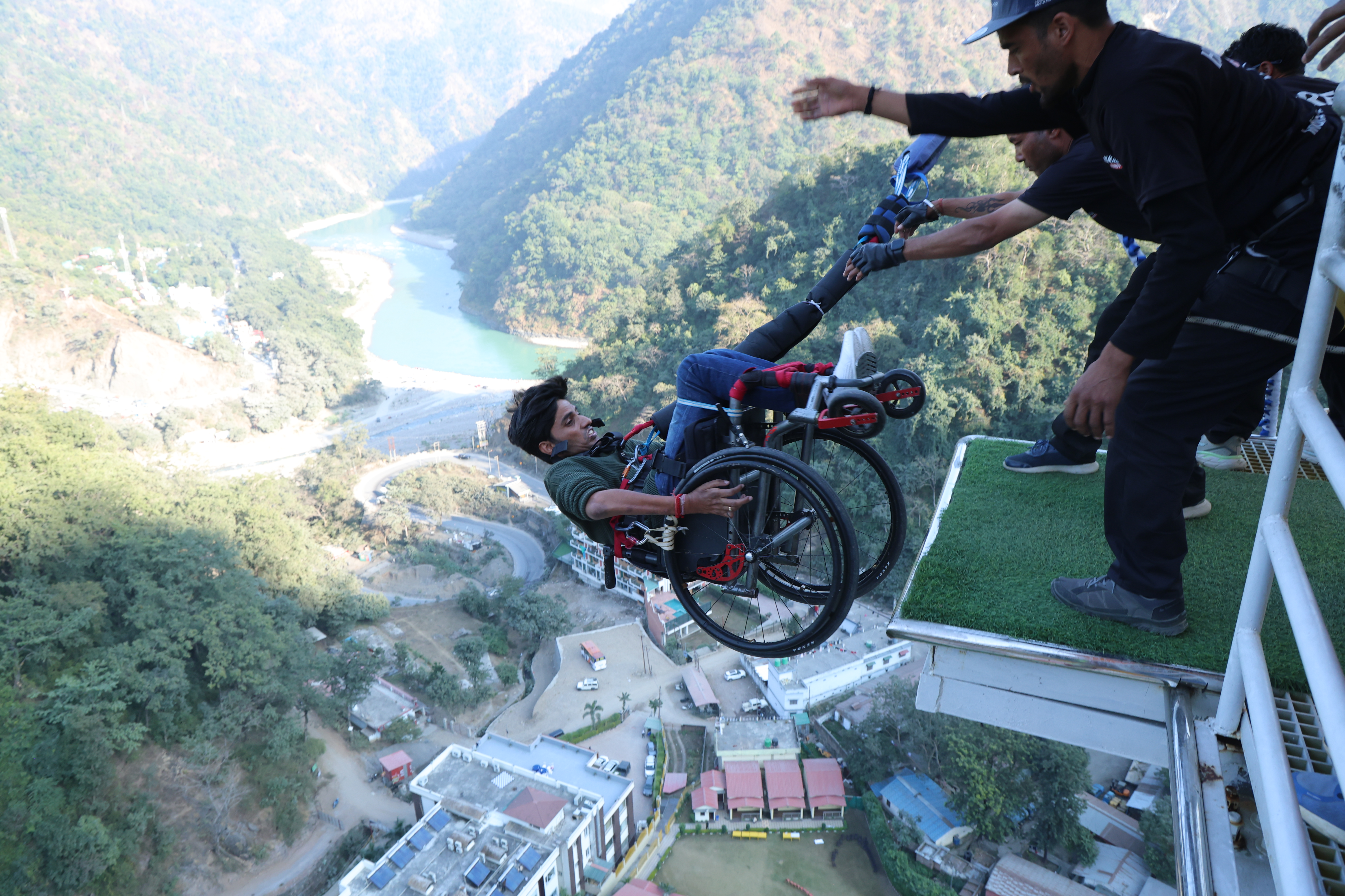 Wheelchair bungee jumping in Rishikesh from a high platform