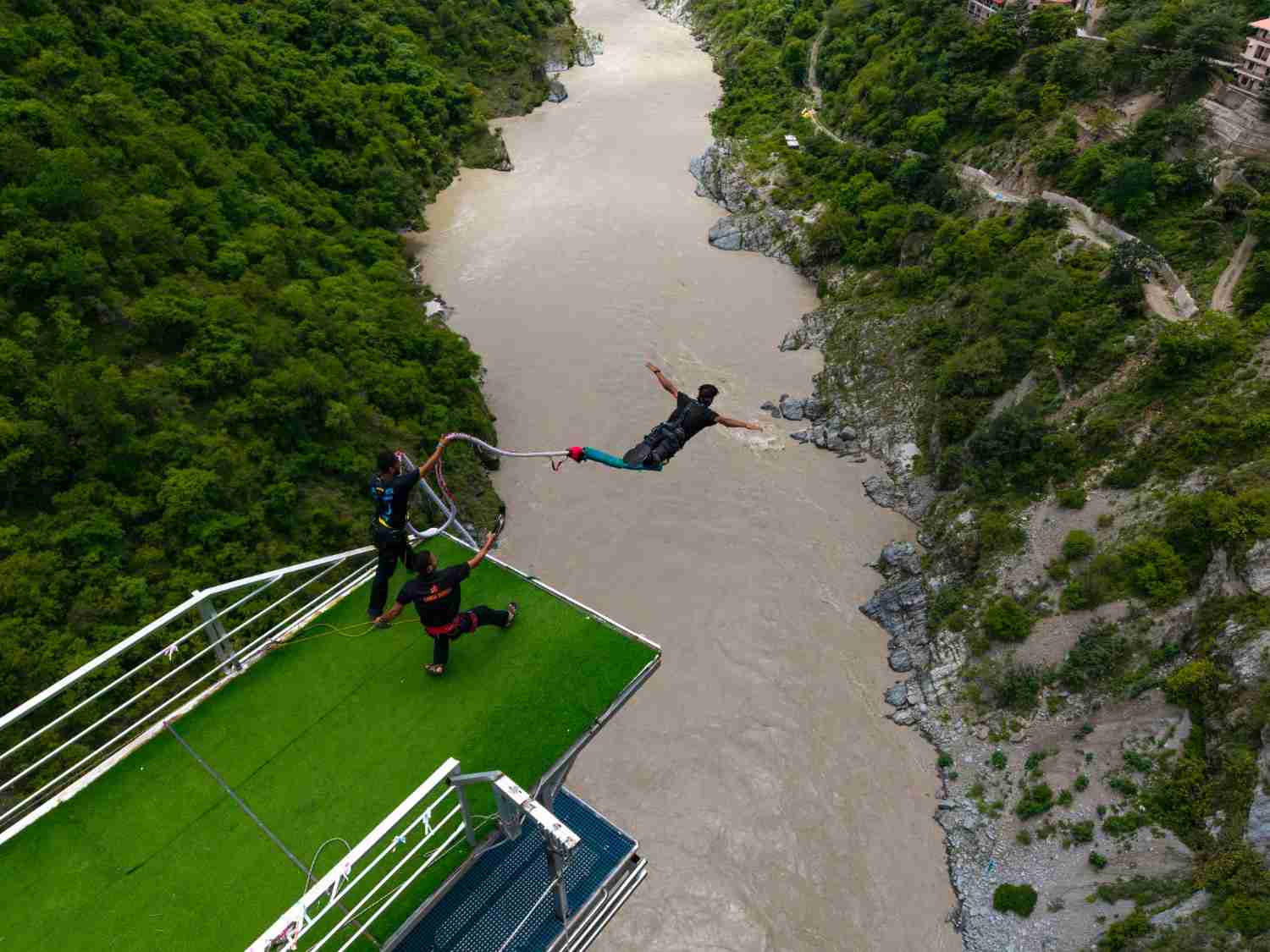 Bungee jumping over the river in Rishikesh from a high platform
