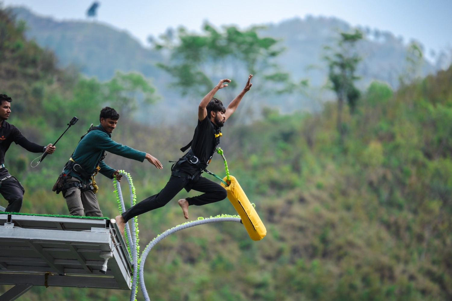 Participant taking a bungy jump from Maa Ganga Bungee platform