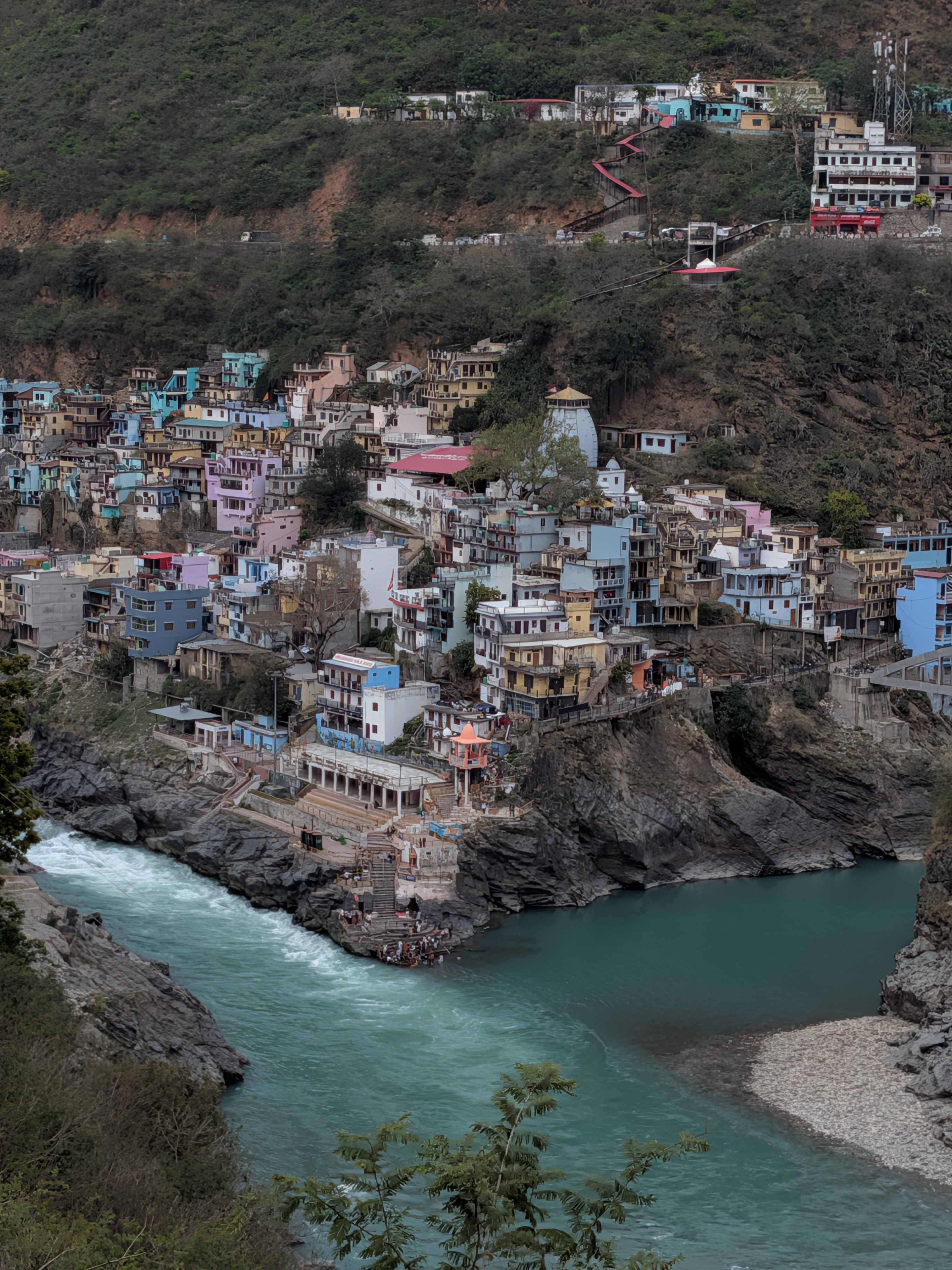 Devprayag Sangam with colourful hillside houses and river