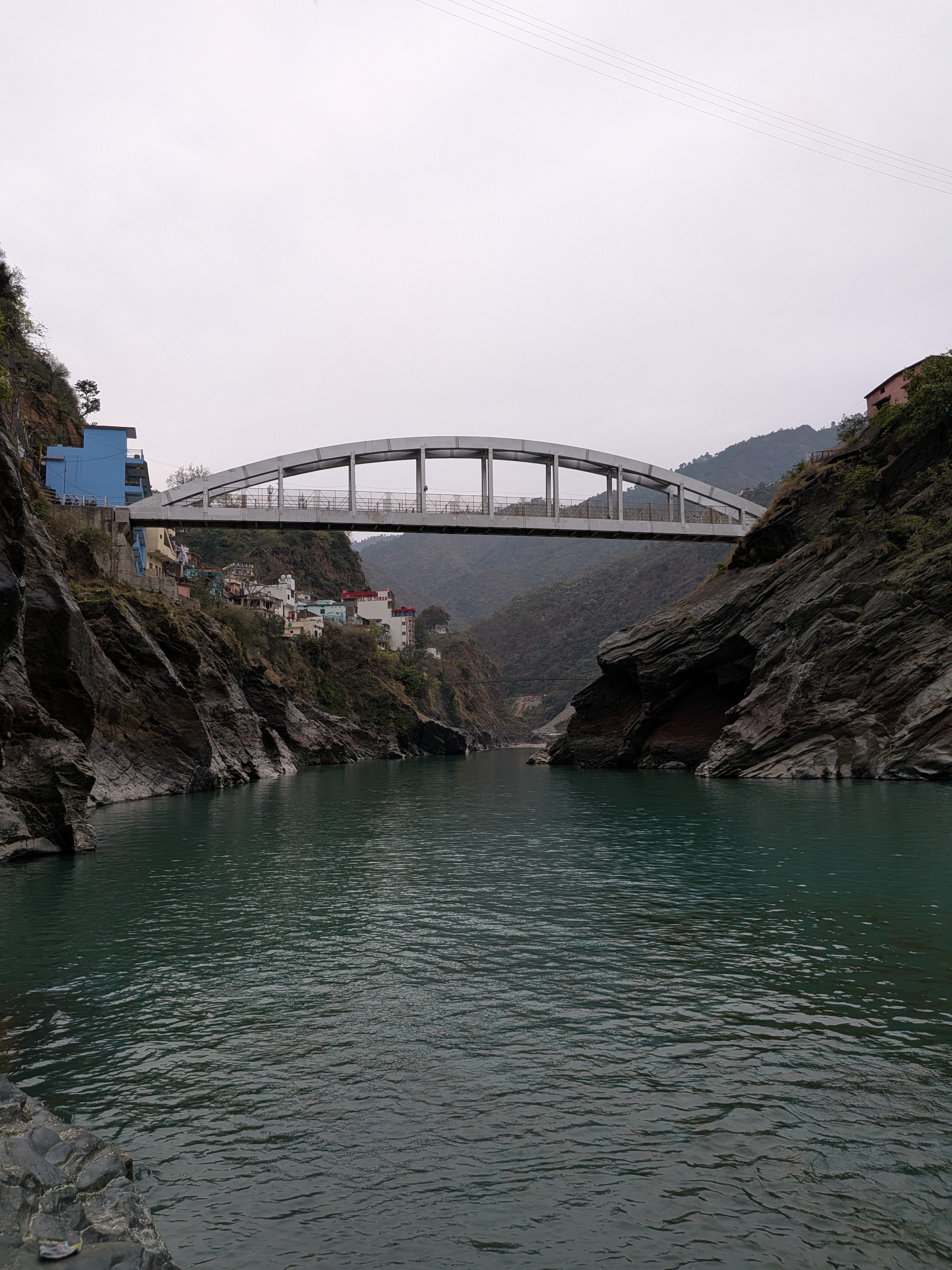 River and bridge surrounded by mountains in Devprayag