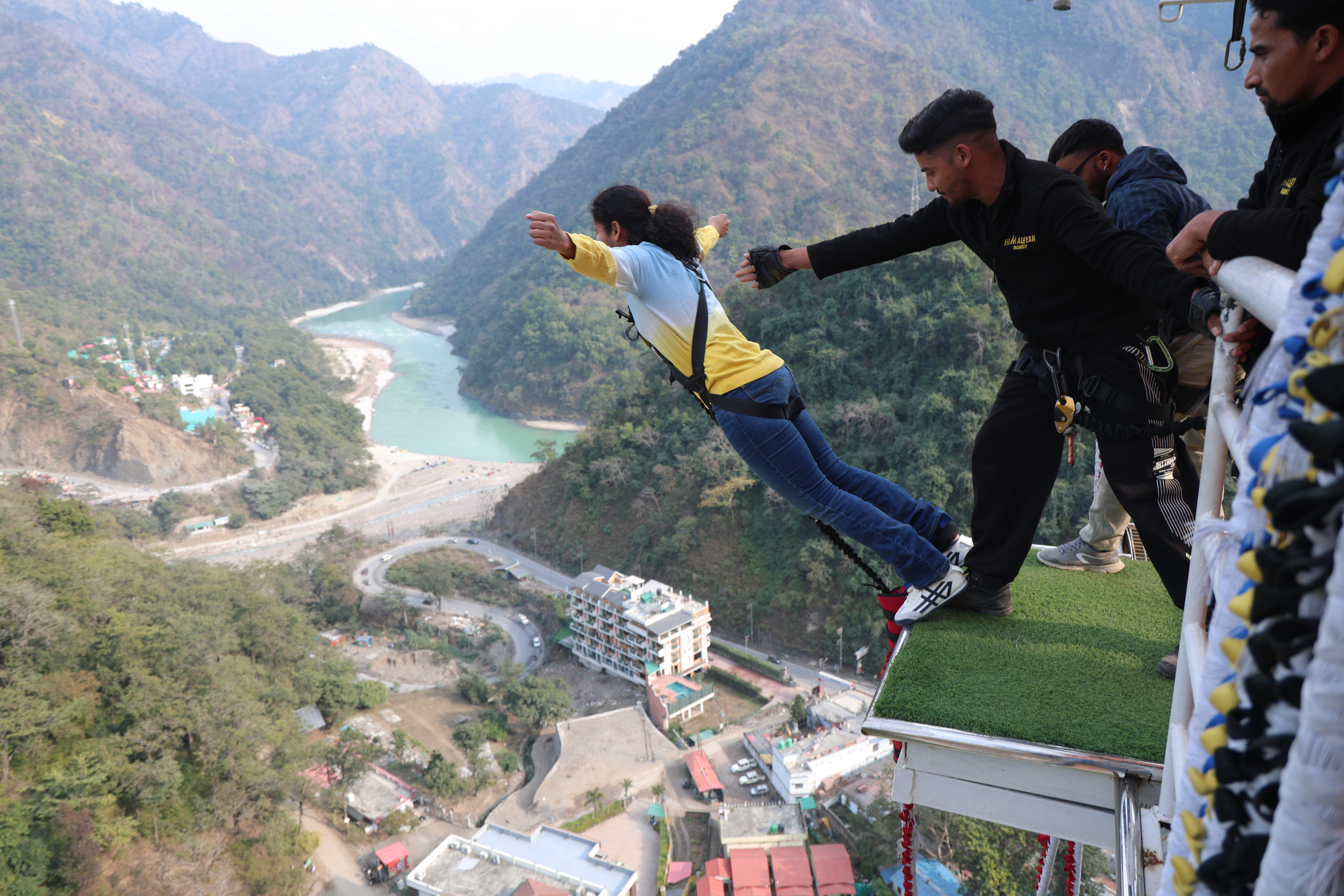 Bungee jumping in Rishikesh with jumper launching from a high platform