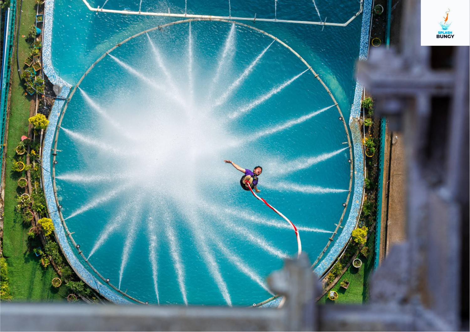 Splash Bungy Rishikesh water-skim bungee jump over a circular pool with water jets.