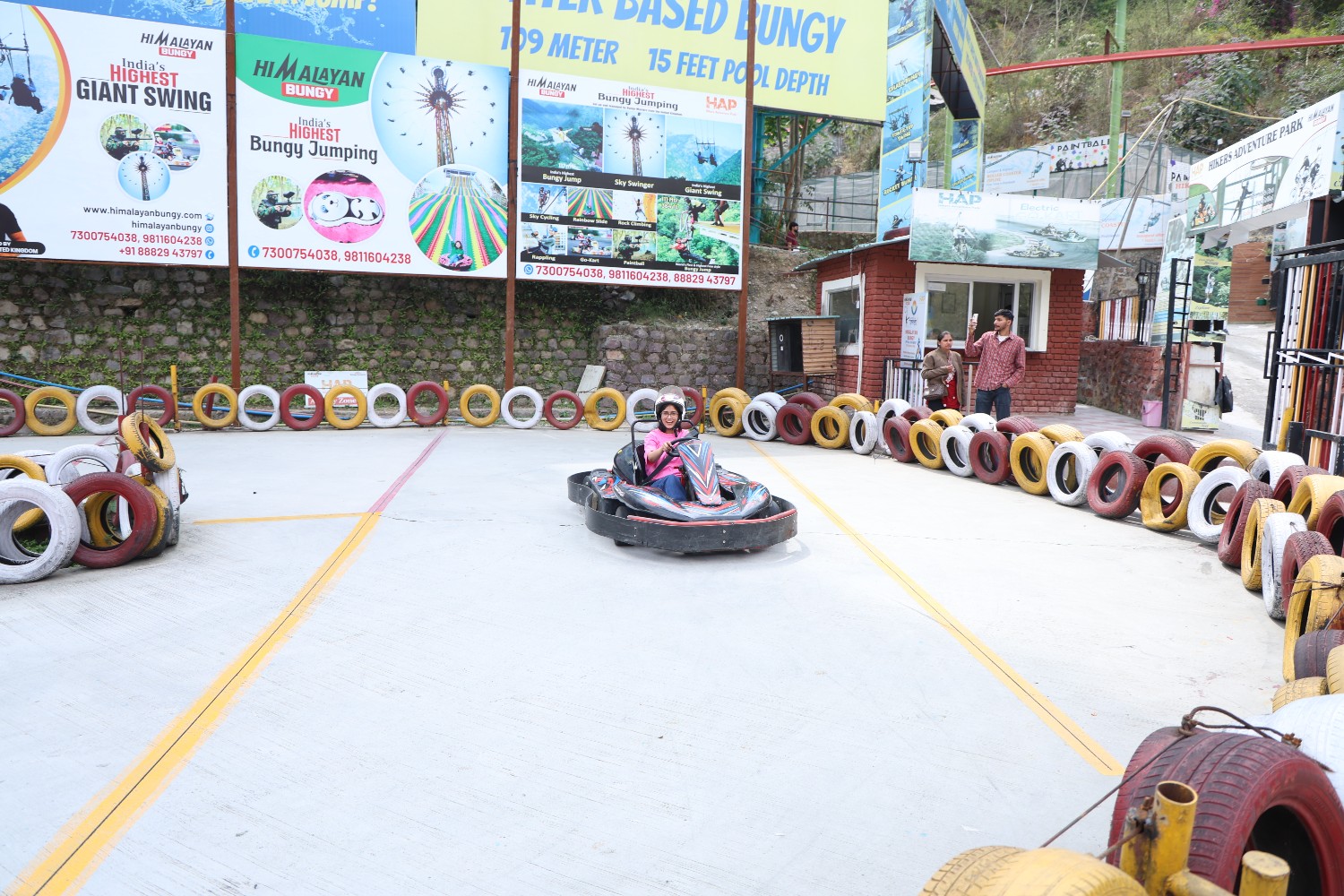 Go-karting activity at an adventure park in Rishikesh with a participant driving on a track.