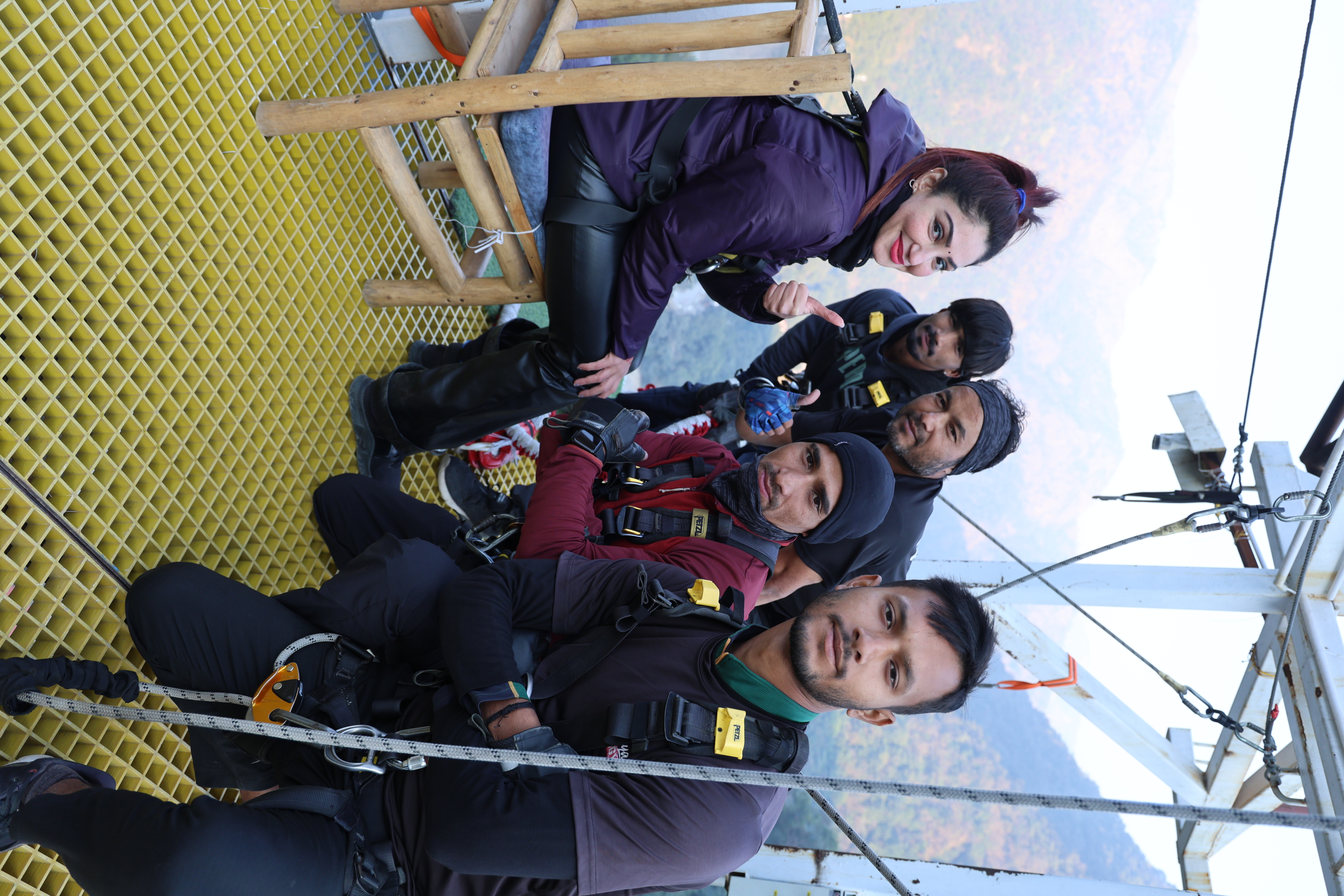 Bungee jumping participant with the adventure crew at a Himalayan bungee jumping platform in Rishikesh.